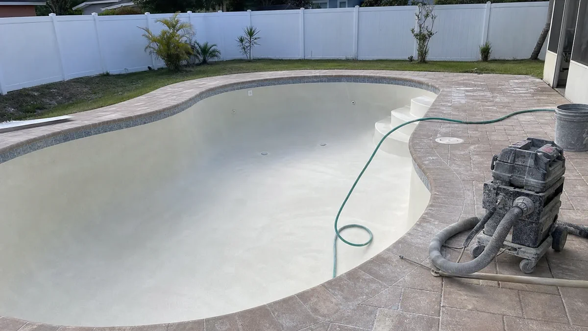 Resurfaced backyard pool filled and finished in Orlando
